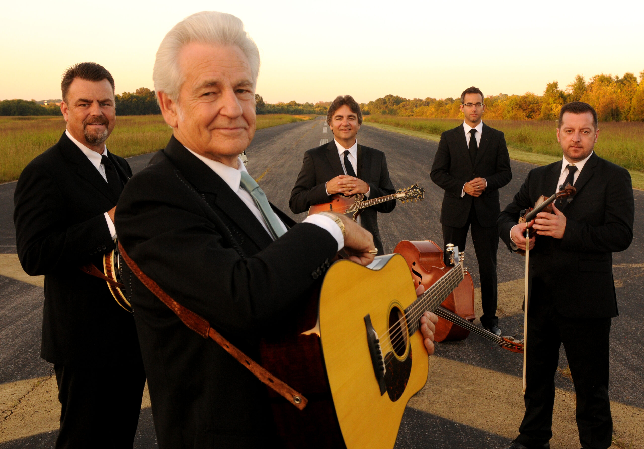 the Del McCoury Band posing on a road