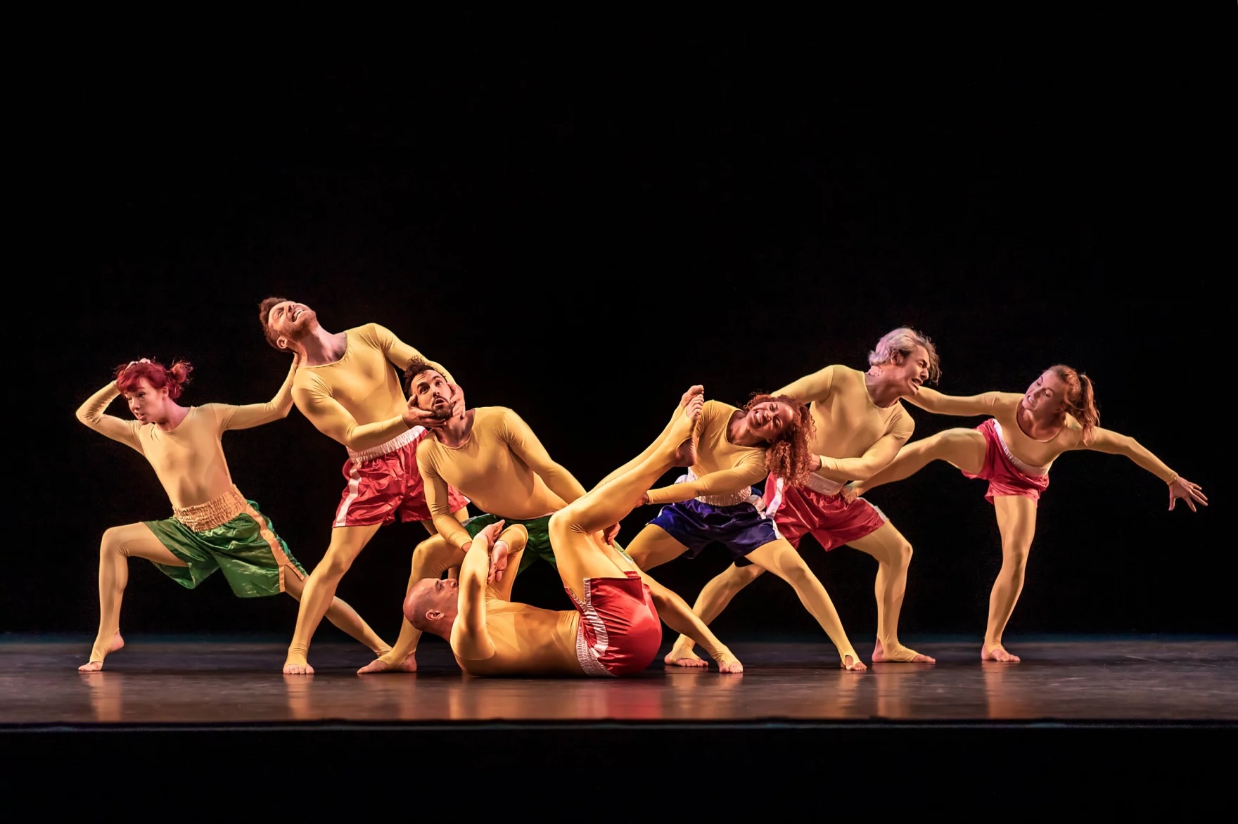 Dancers from the dance group Pilobolus performing on a stage