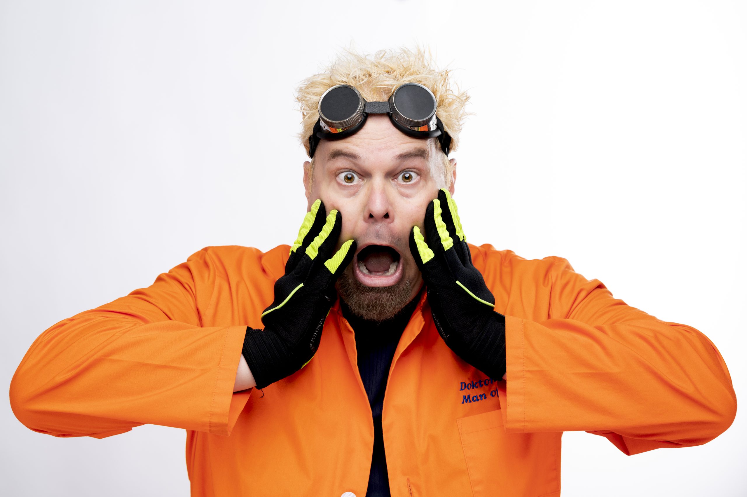 Doctor Kaboom wearing an orange jacket, goggles, and gloves