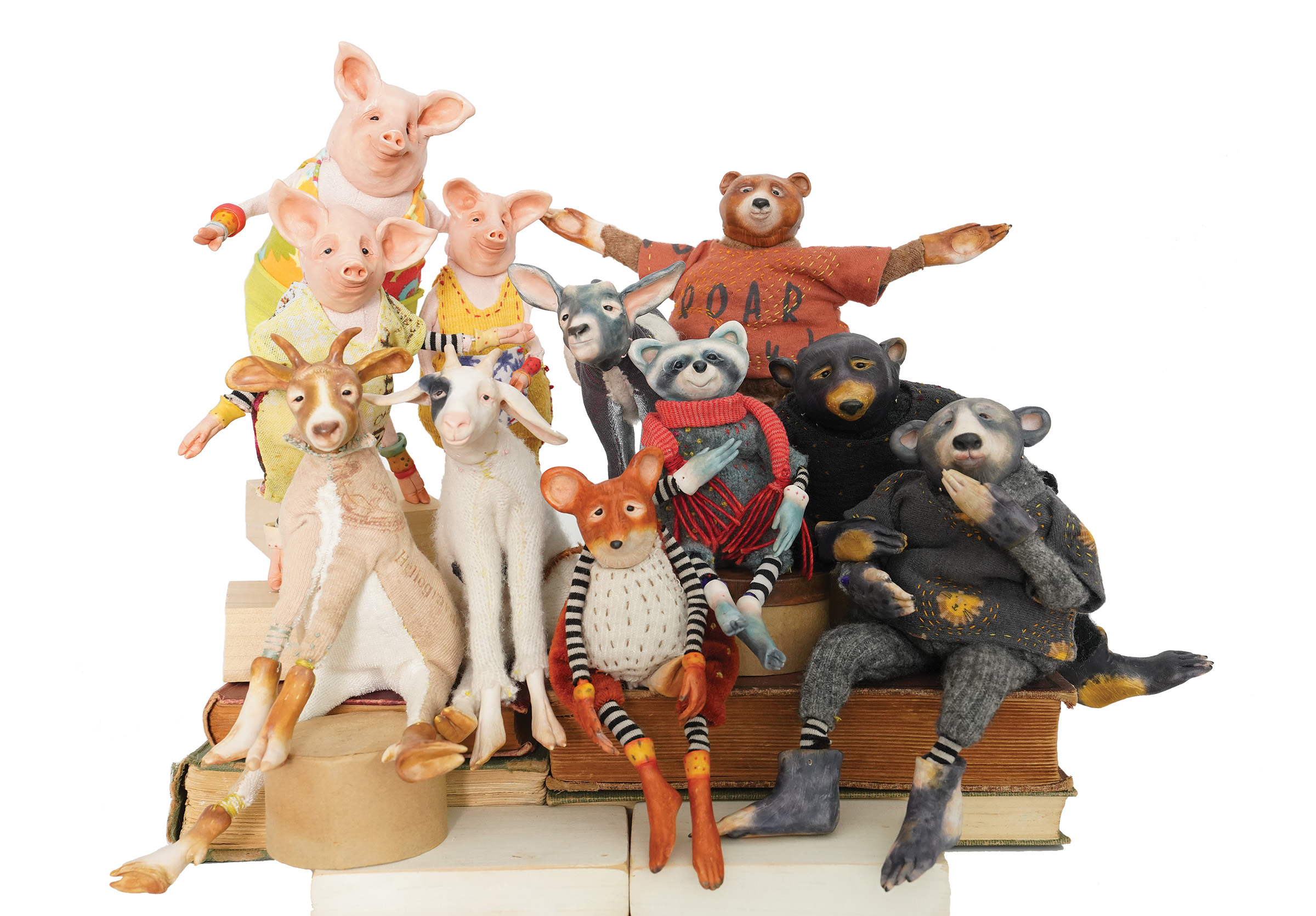 Toy animals arranged on a set of books