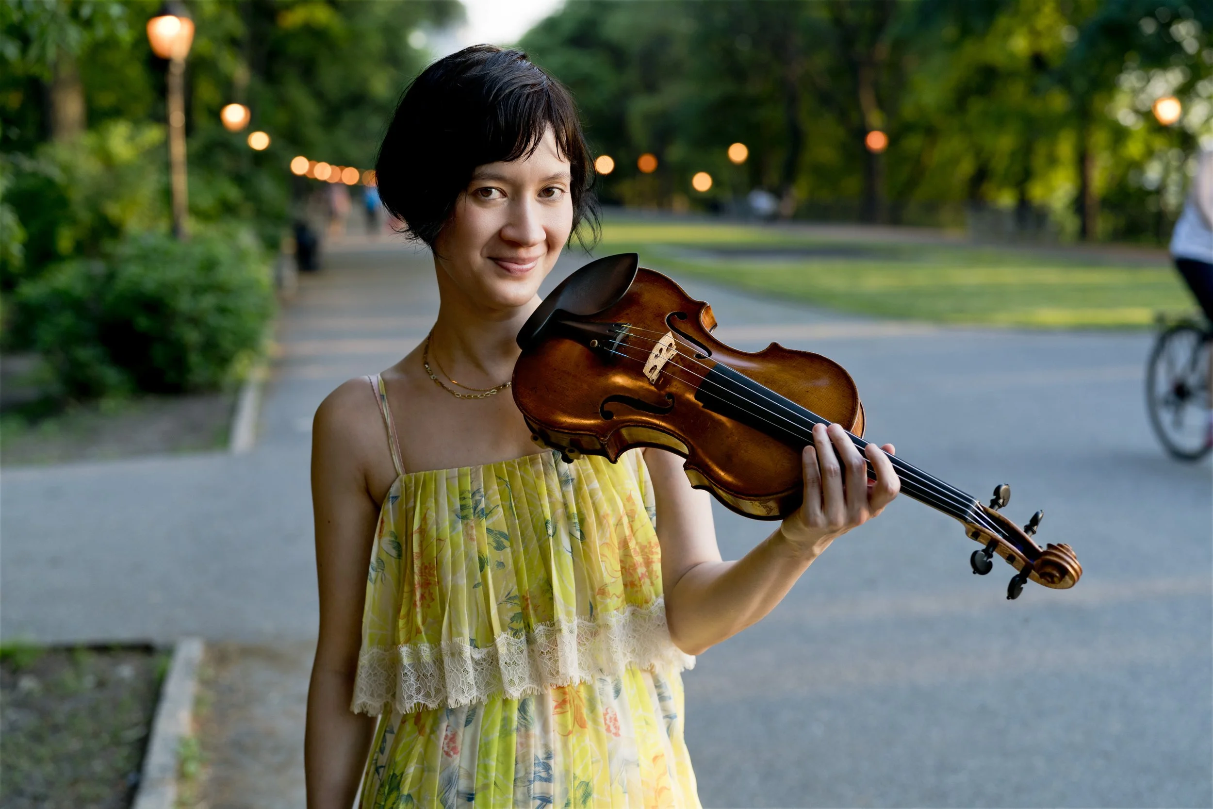 A woman holding a violin