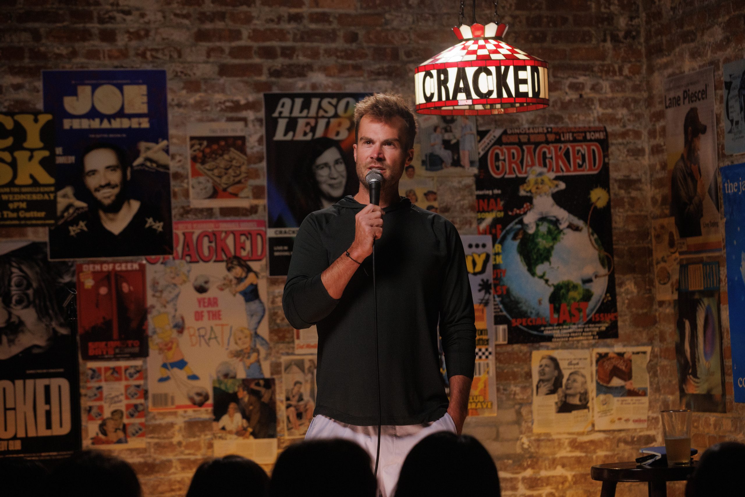 Comedian David Drake performing at a club