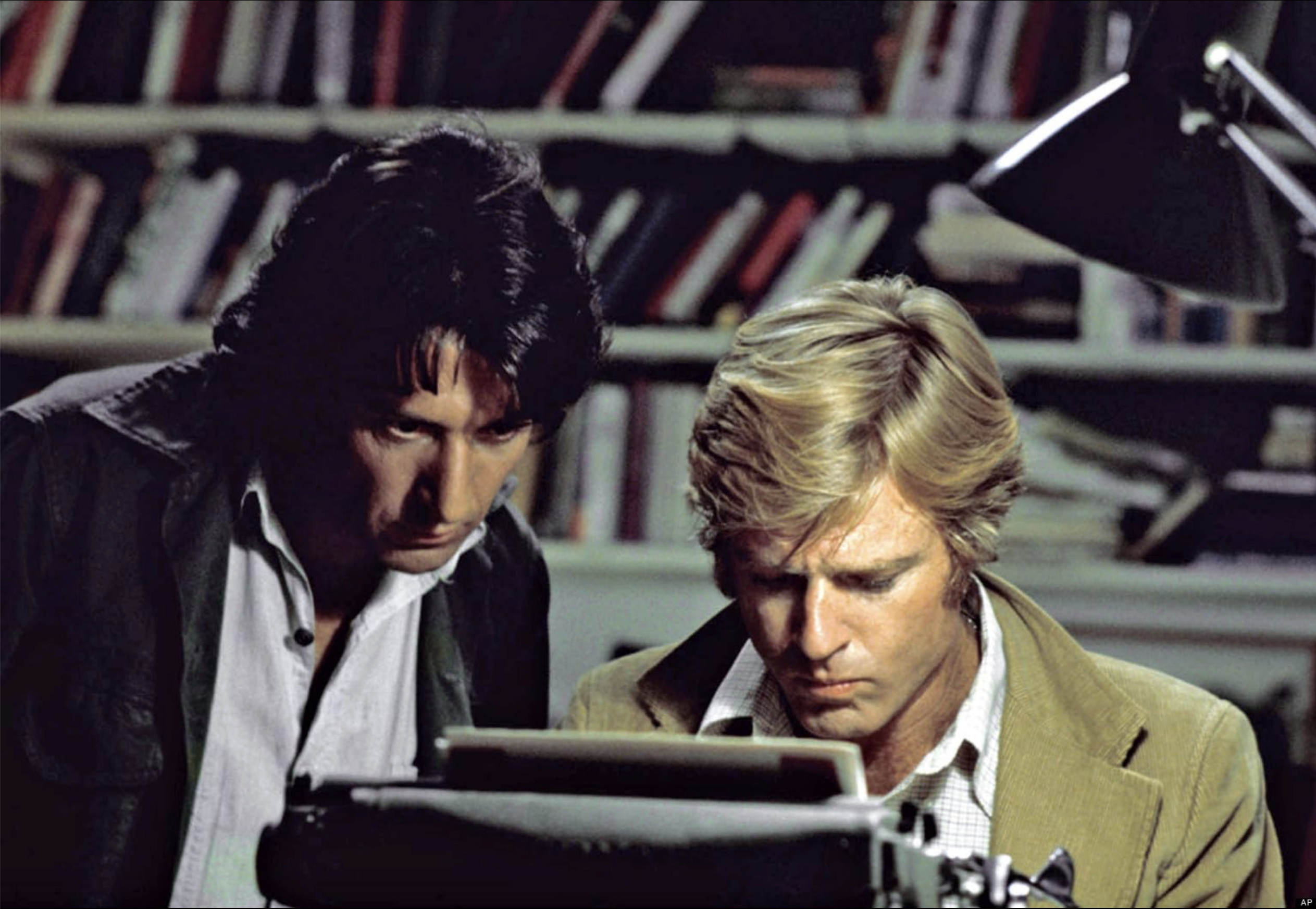 Two men – actors Dustin Hoffman and Robert Redford – in front of a typewriter