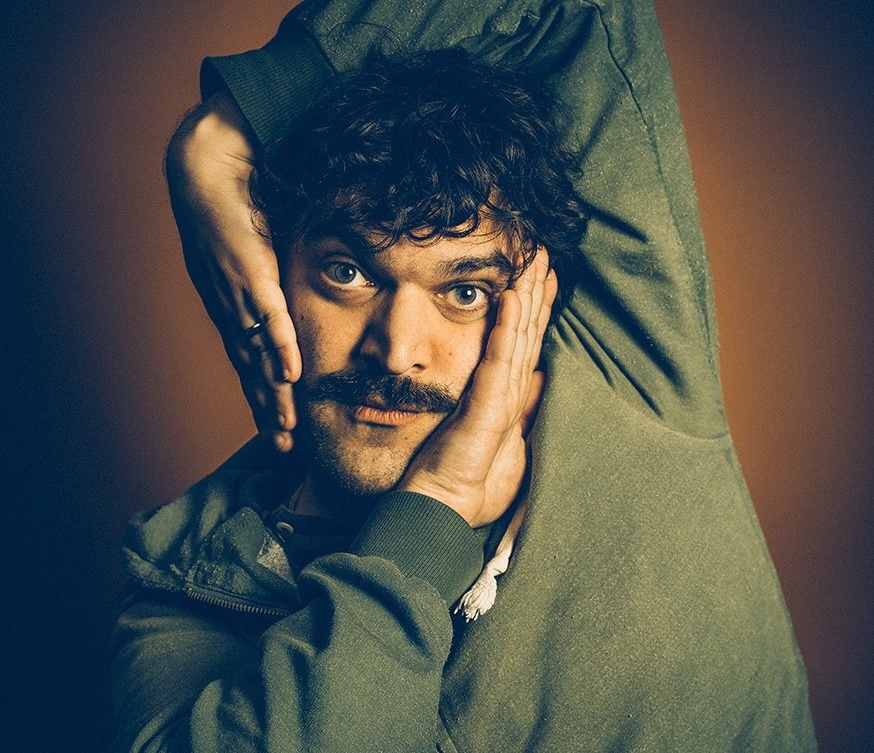 A man with his hands around his face