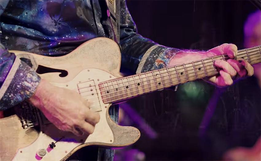 close up of a guitar player